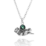 Floating Sea Otter Holding Round Abalone shell Oxidized Silver Pendant