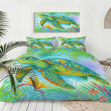 Colorful turtle and tropical leaf bedding set on a bed with matching wall art.