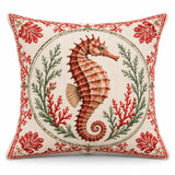 Seahorse coastal Christmas cushion cover with festive red and green details on cream, shown on a white background