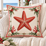 Starfish coastal Christmas cushion cover on a white woven chair with a cream throw