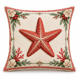 Starfish coastal Christmas cushion cover with festive red and green details on cream, shown on a white background