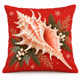 Coral-red Christmas murex shell cushion cover with evergreen and snowflakes on a white background
