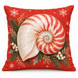 Coral-red Christmas nautilus shell cushion cover with evergreen and snowflakes on a white background