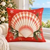 Coral-red Christmas scallop shell cushion cover with evergreen and snowflakes styled in a coastal Christmas room
